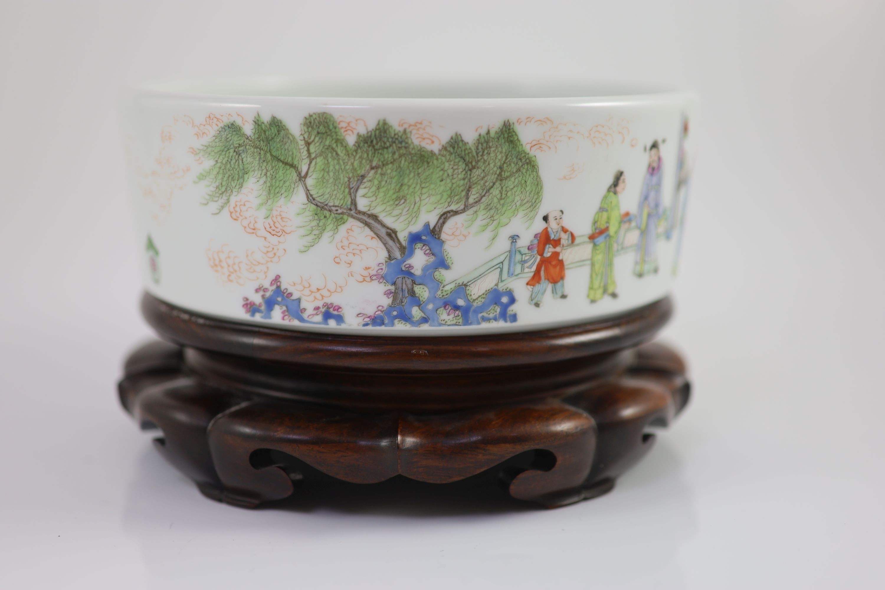 A Chinese famille rose cylindrical bowl, Yongzheng mark but Republic period, 19cm diameter, 7cm high, wood stand